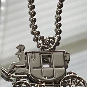 Coach Silver Carriage  charm on short chain.